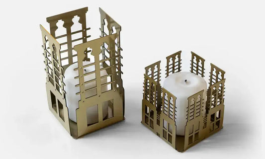 Votive shaped candle design inspired by UAE architecture made with a luxury metal finish designed by Kashida