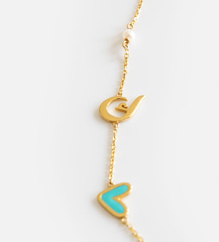 Custom made gold pendant earrings made with Arabic calligraphy letters