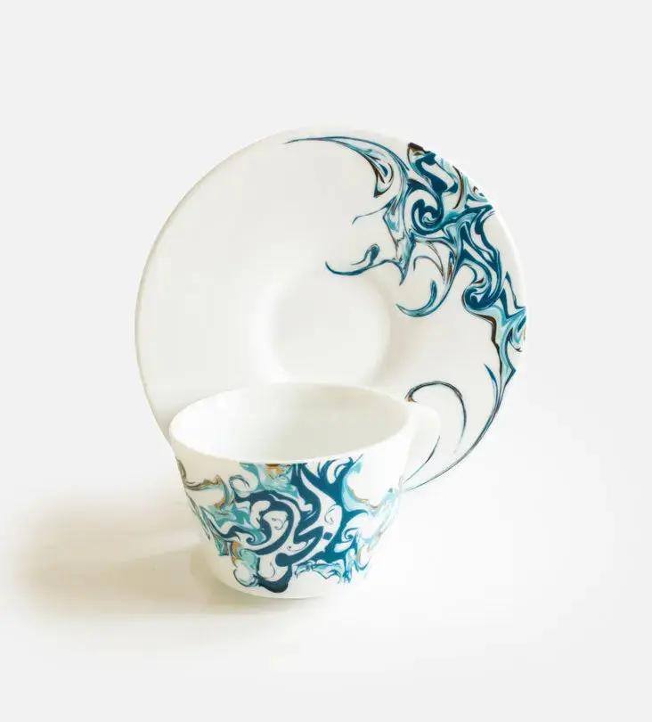 Contemporary porcelain espresso cups with Arabic calligraphy fluid art