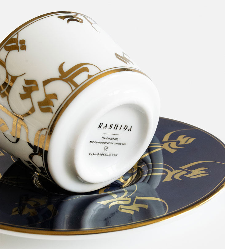 Elegant royal blue and gold espresso cup and saucer with Arabic calligraphy pattern print on porcelain