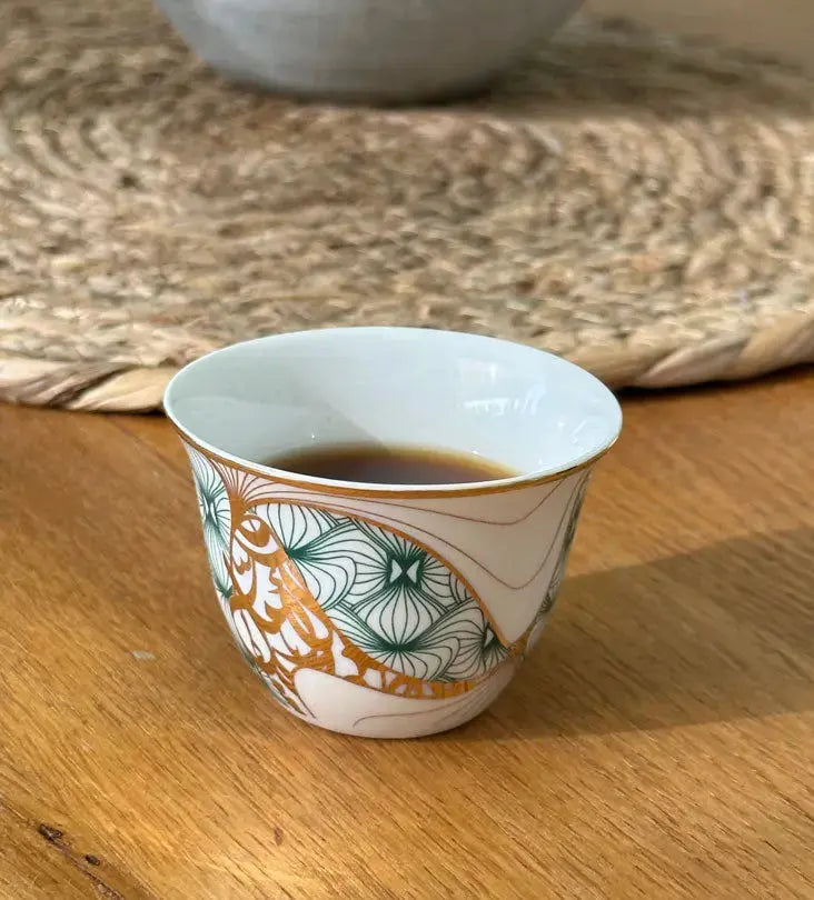Porcelain Arabic coffee cup by Kashida in emerald green and gold hues