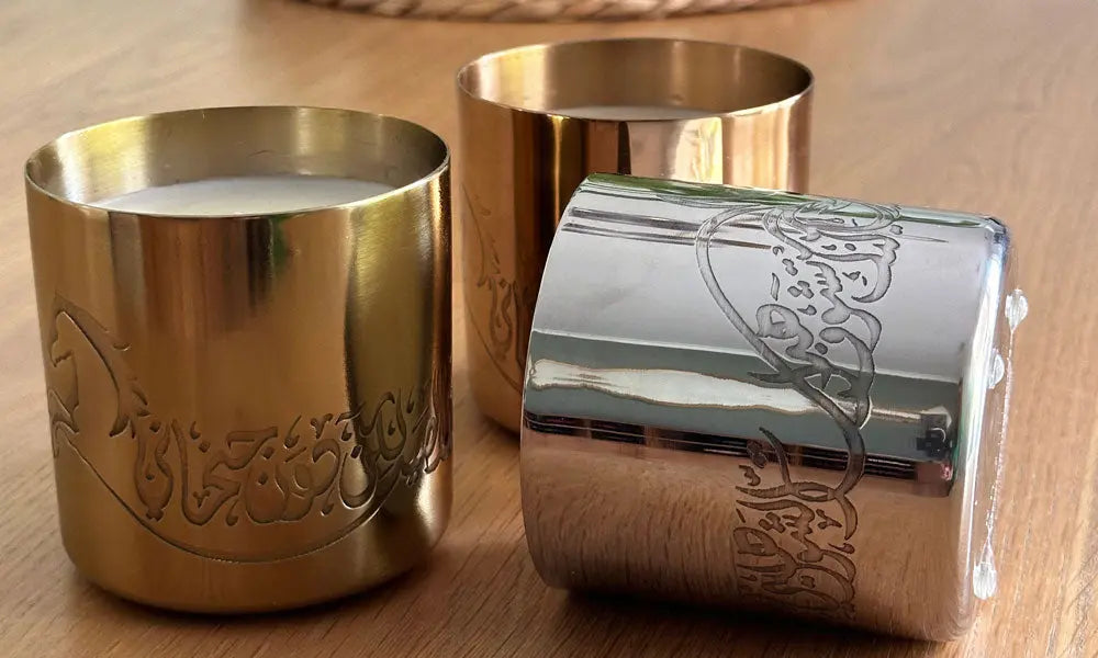 Hand-poured scented candles with fragrances that relate to the UAE in three beautiful metal canisters with Arabic calligraphy etchings featuring a poem by Sheikh Mohamad Bin Rashed Al Maktoum.