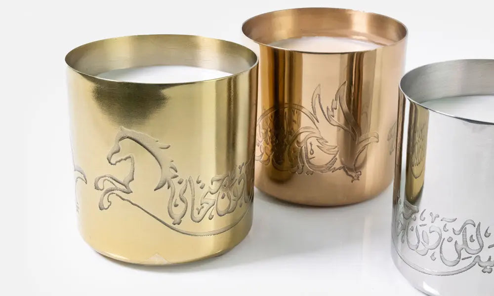 Hand-poured scented candles with fragrances that relate to the UAE in three beautiful metal canisters with Arabic calligraphy etchings featuring a poem by Sheikh Mohamad Bin Rashed Al Maktoum.