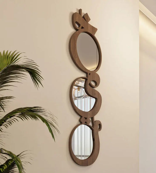 Modern contemporary wooden mirrors in Arabic calligraphy that reads khayr, meaning goodness