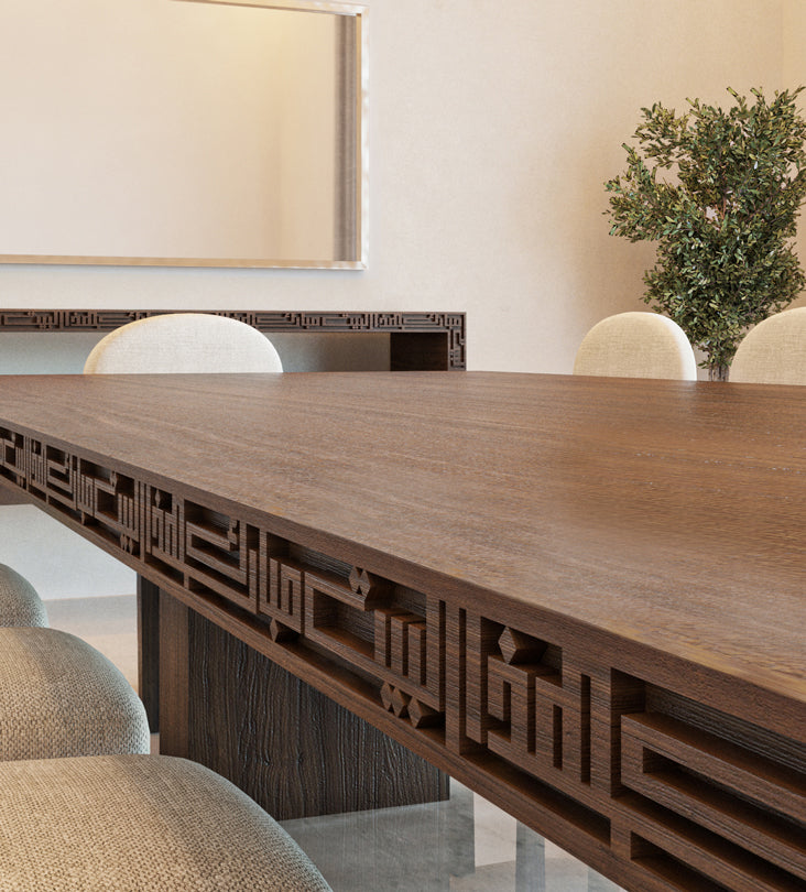 Luxurious wide wooden dining table with arabic calligraphy carvings that fits up to 12 people.