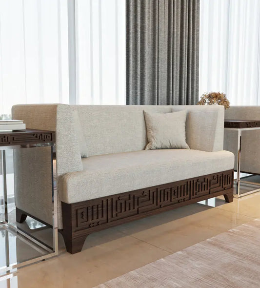 Beige upholstered 3 seater sofa featuring Arabic calligraphy carved woodwork from Kashida design