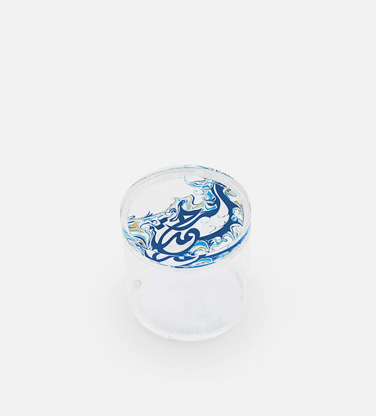Contemporary transparent acrylic storage cylinders with Arabic calligraphy fluid art