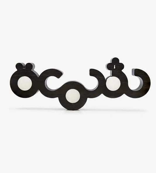 Flat wooden candleholder for tea light candles featuring the word candle in Arabic calligraphy