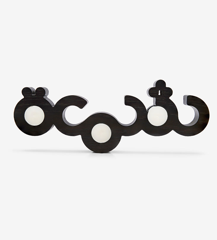 Flat wooden candleholder for tea light candles featuring the word candle in Arabic calligraphy