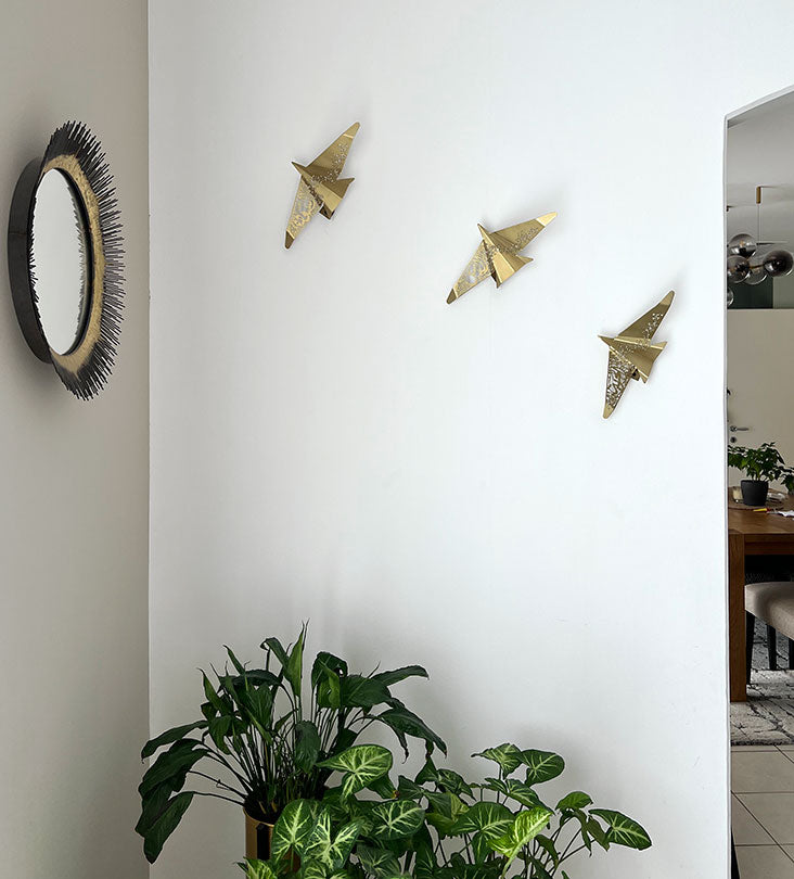 Beautiful brass plated decorative wall hangers shaped like origami birds with modern Arabic calligraphy designed by Kashida