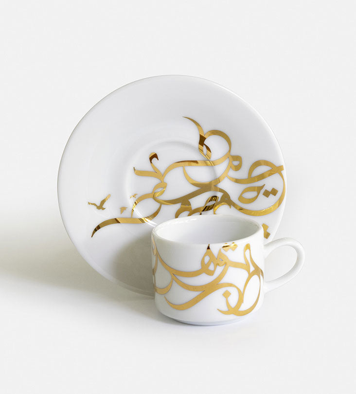 Contemporary gold and silver porcelain espresso cups with Arabic graffiti print