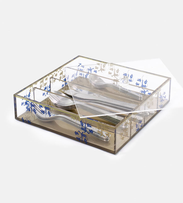 Transparent acrylic cutlery holder with four compartments featuring modern Arabic calligraphy by Kashida