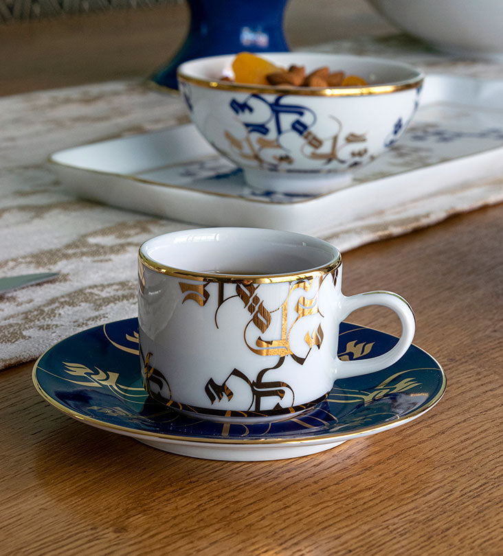 Elegant royal blue and gold espresso cup and saucer with Arabic calligraphy pattern print on porcelain