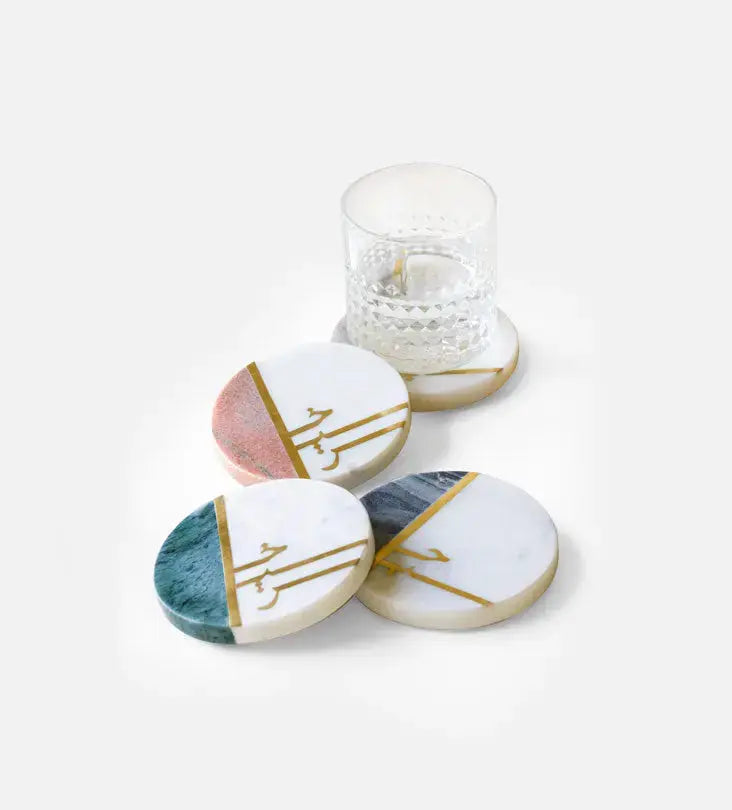 Beautiful pastel colored marble coasters with brass detail in Arabic calligraphy by Kashida