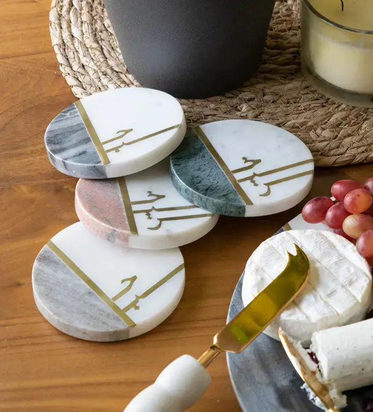 Beautiful pastel colored marble coasters with brass detail in Arabic calligraphy by Kashida