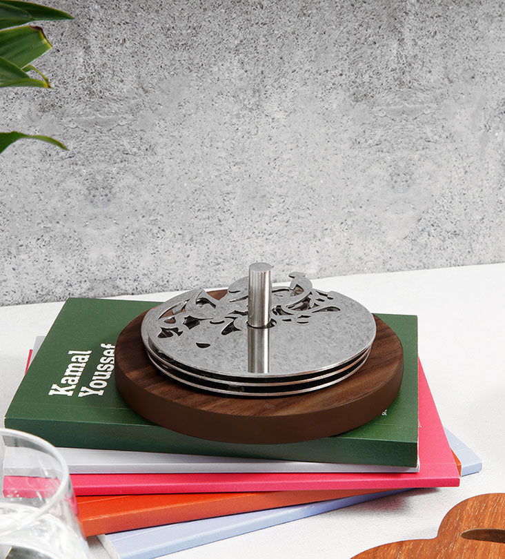 Round silver coasters with wooden base in Arabic calligraphy