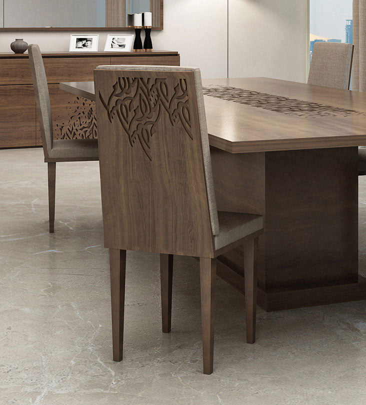 Luxury wooden dining table with Arabic calligraphy letters engraved in the middle