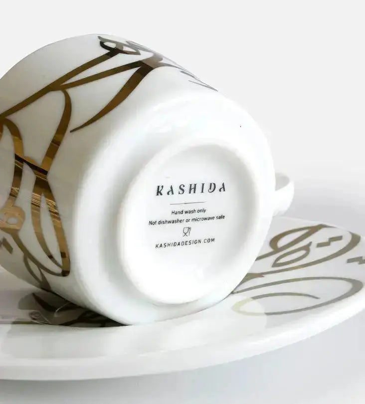 Contemporary gold and silver porcelain espresso cups with Arabic graffiti print