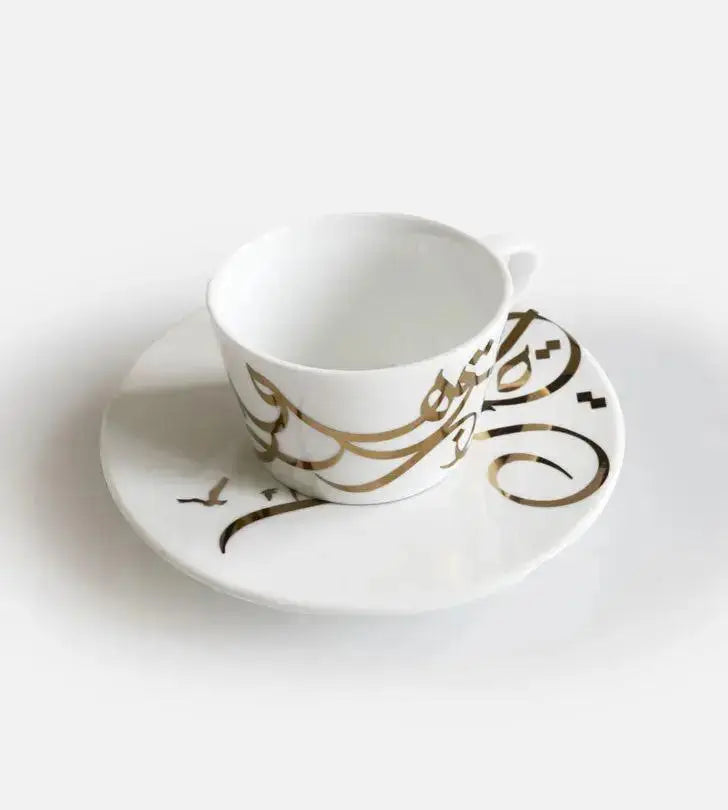 Contemporary gold and silver porcelain espresso cups with Arabic graffiti print