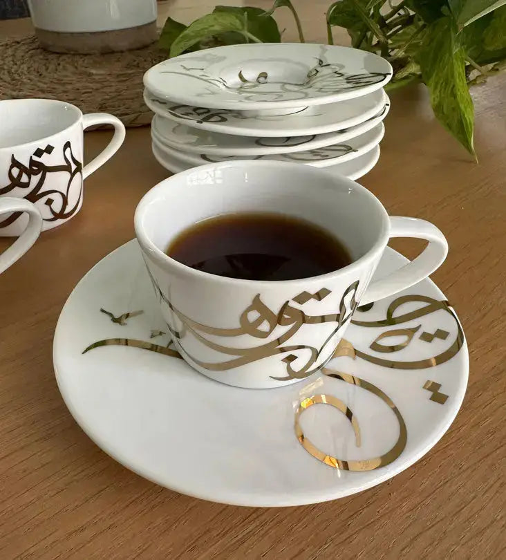 Contemporary gold and silver porcelain espresso cups with Arabic graffiti print