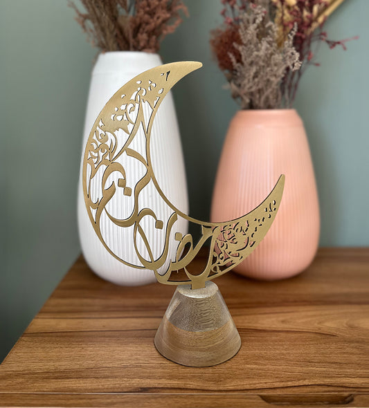 Arabic Calligraphy crescent home décor for Ramadan by Kashida design, in the shape of a Ramadan Hilal with Arabic calligraphy