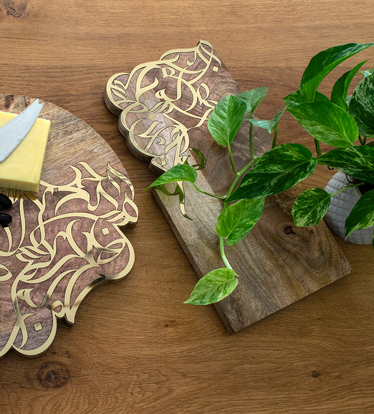 Contemporary cheese board in mango wood with Arabic calligraphy inlay