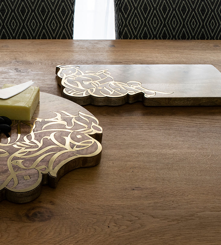 Contemporary cheese board in mango wood with Arabic calligraphy inlay