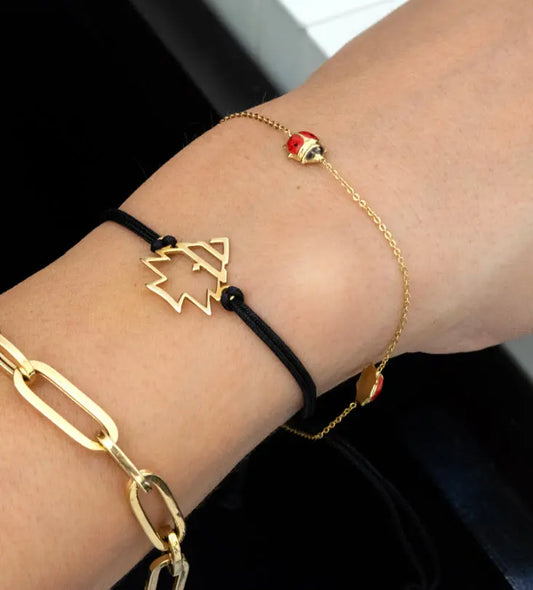 Modern gold bracelet featuring Lebanon's cedar tree designed by Kashida