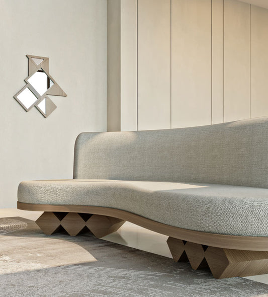 Modern fluid sofa with organic shape and simple neutral tone upholstery from Kashida's Nuqat collection.