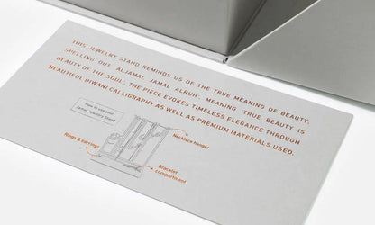 VIP invitation gift for Sharjah Jewelry and Watch Expo, featuring a marble and brass jewelry stand in Arabic calligraphy, designed by Kashida