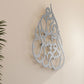 Tear drop shaped wall art in Arabic calligraphy with inspirational words
