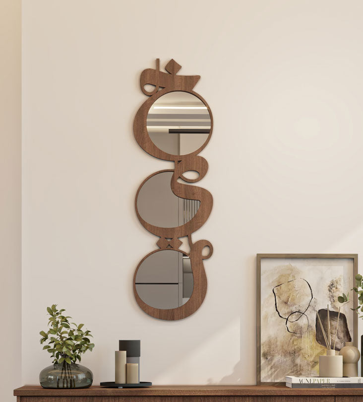 Modern contemporary wooden mirrors in Arabic calligraphy that reads khayr, meaning goodness