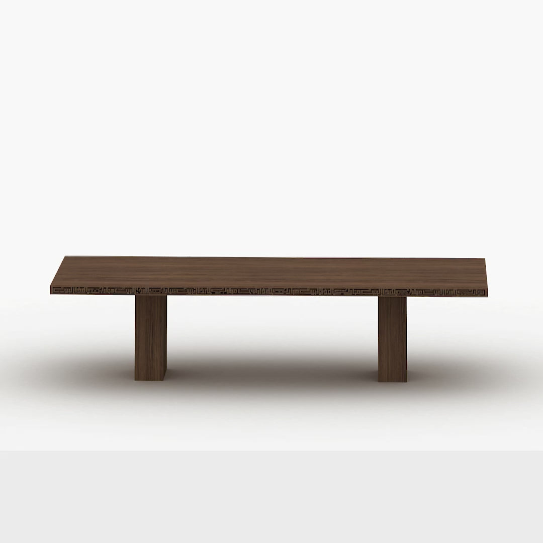 Luxurious wide wooden dining table with arabic calligraphy carvings that fits up to 12 people.