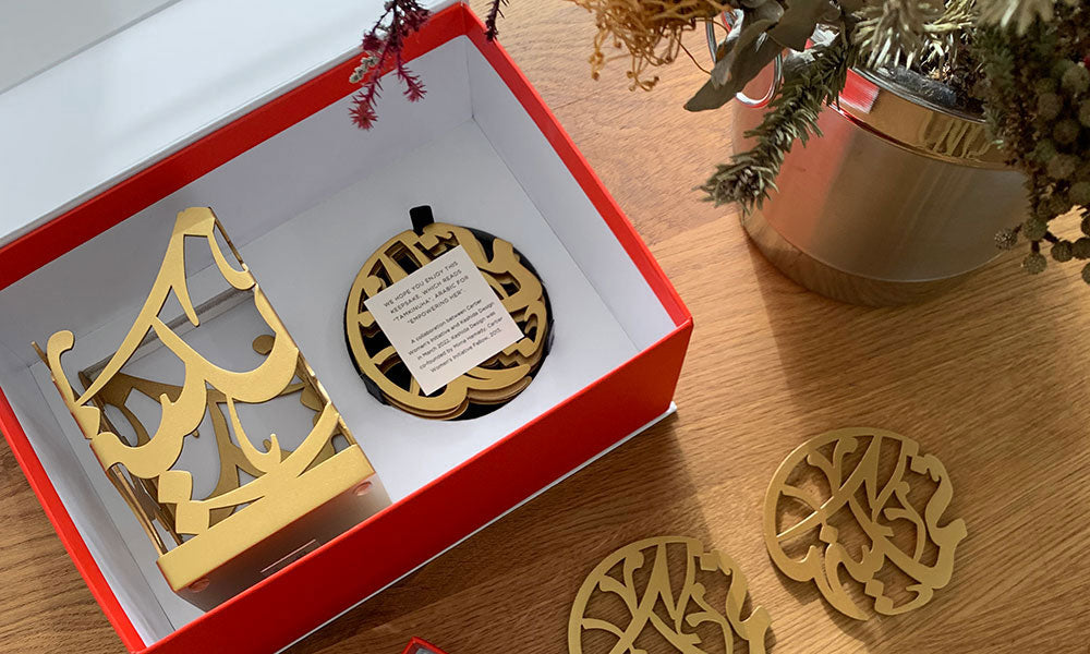 Gift boxes for Cartier Women’s Initiative Awards with Arabic calligraphy coasters and Arabic calligraphy candleholders