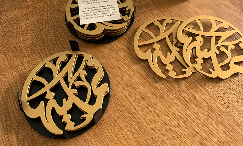 Gift boxes for Cartier Women’s Initiative Awards with Arabic calligraphy coasters and Arabic calligraphy candleholders.