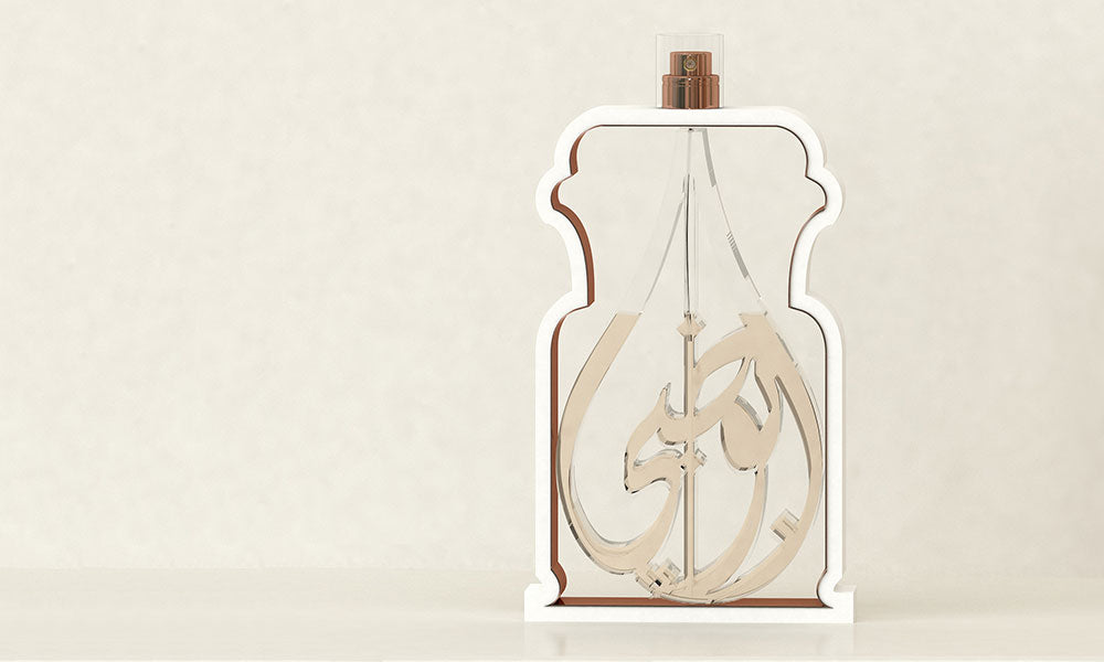 Glass perfume bottles in Arabic calligraphy spelling out the word Abu Dhabi