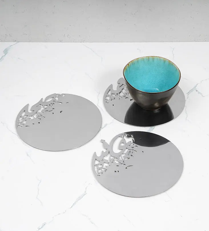 Silver stainless steel placemat in Arabic calligraphy