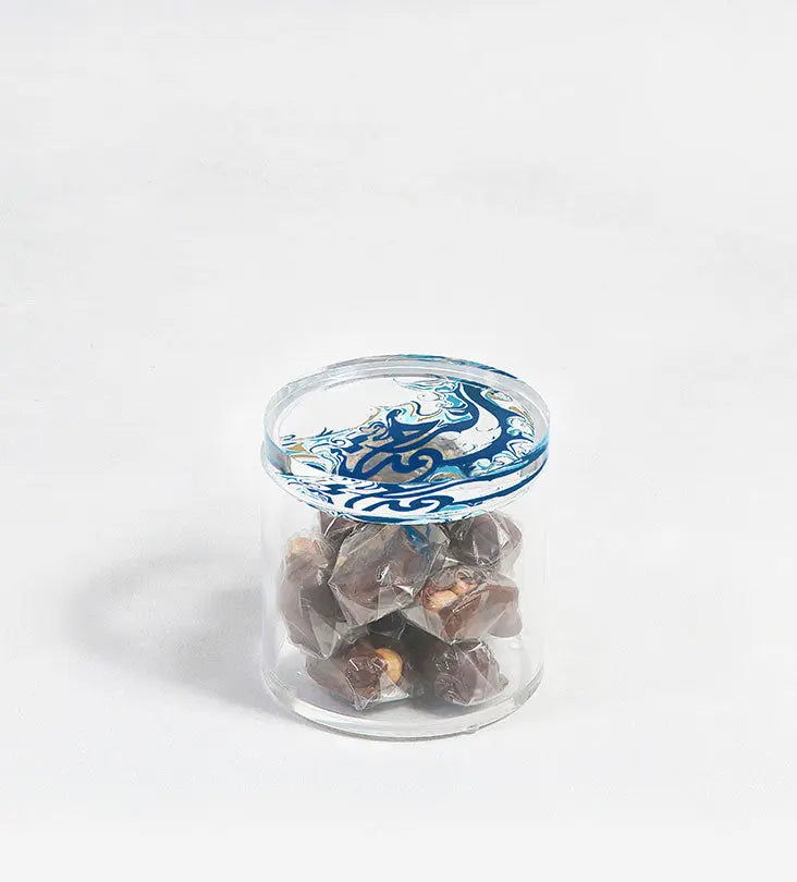Contemporary transparent acrylic storage cylinders with Arabic calligraphy fluid art