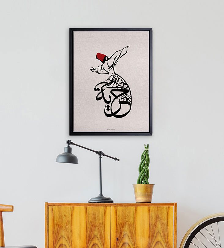 Framed art featuring Sufi twirling dervish with Arabic calligraphy that reads freedom