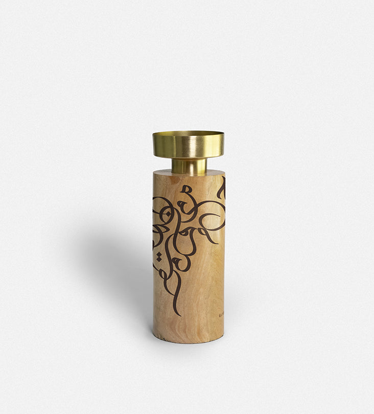 Wooden cylinder candle holders with brass top featuring Arabic graffiti etchings