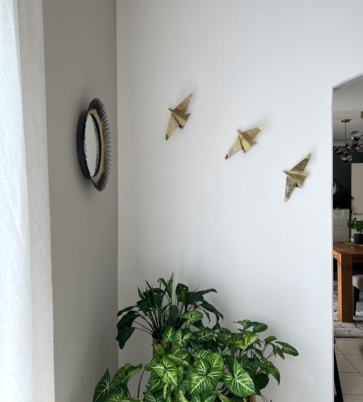 Beautiful brass plated decorative wall hangers shaped like origami birds with modern Arabic calligraphy designed by Kashida