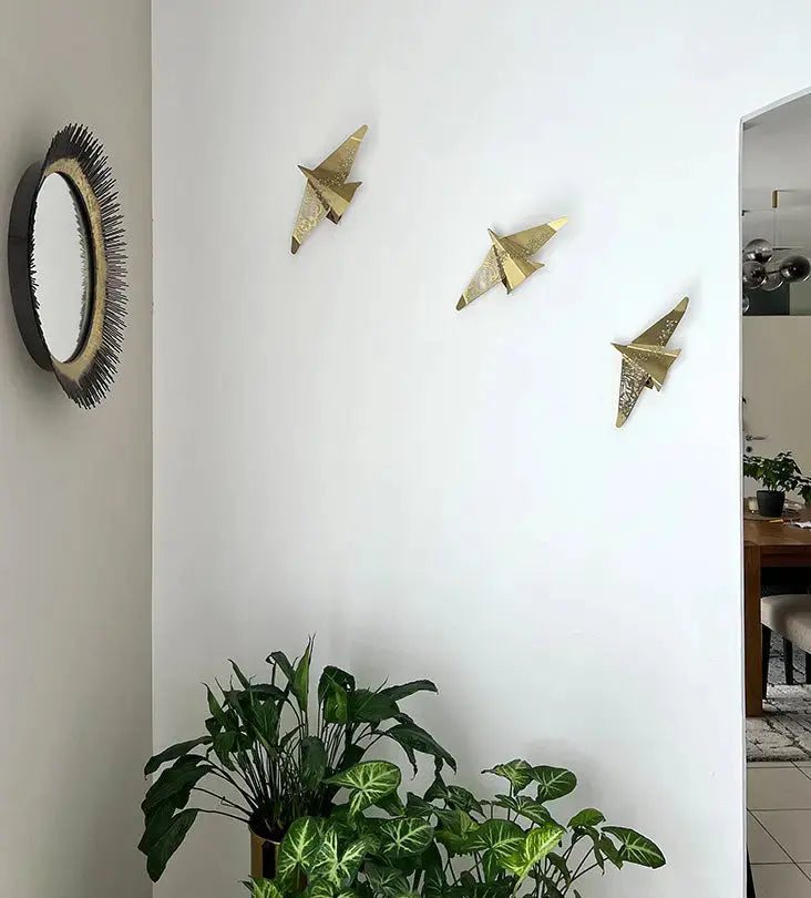 Beautiful brass plated decorative wall hangers shaped like origami birds with modern Arabic calligraphy designed by Kashida