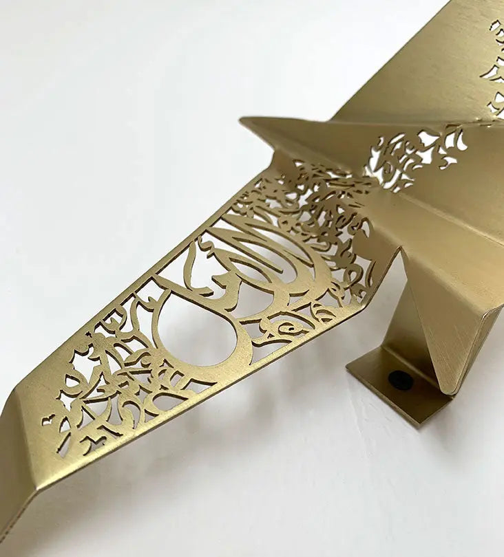 Beautiful brass plated decorative wall hangers shaped like origami birds with modern Arabic calligraphy designed by Kashida