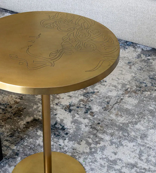 Brass round table with contemporary Arabic graffiti etchingsBrass round table with contemporary Arabic graffiti etchings