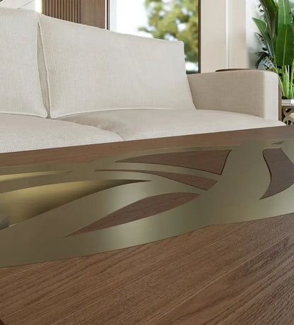 Luxurious gold and walnut wood coffee table with arabic letters woodwork on edges featuring modern arabic calligraphy from kashida design