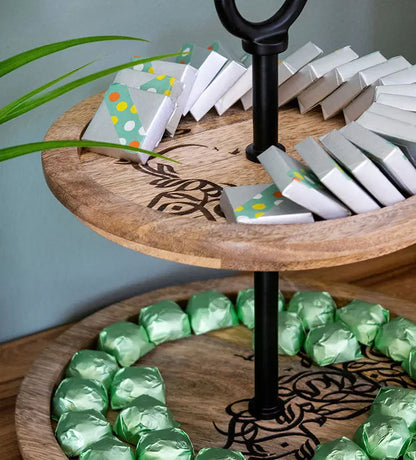Wooden double-tier stand with Arabic graffiti etching