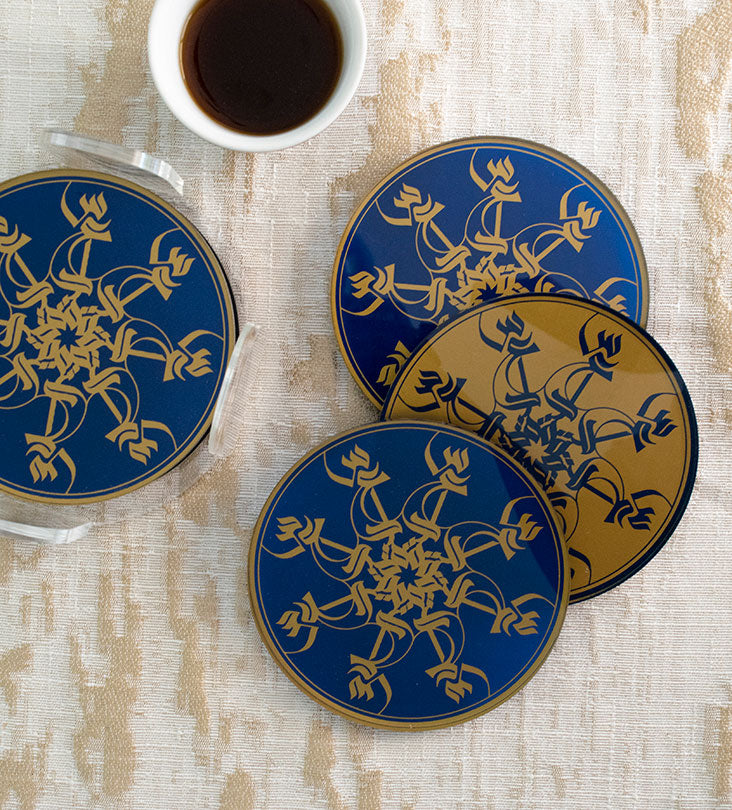 Set of six round acrylic coasters in royal blue and gold Arabic calligraphy pattern