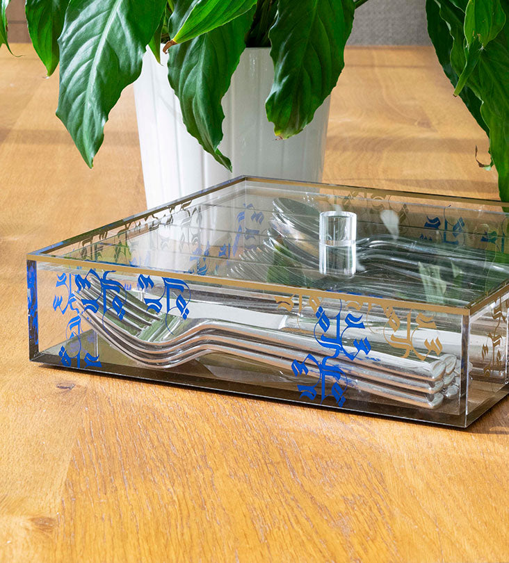 Transparent acrylic cutlery holder with four compartments featuring modern Arabic calligraphy by Kashida