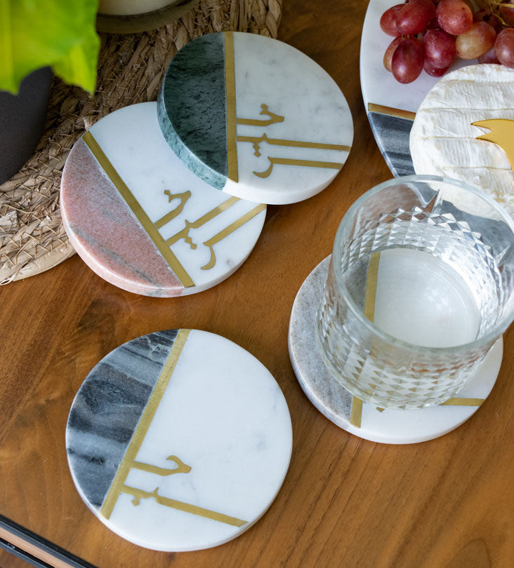 Beautiful pastel colored marble coasters with brass detail in Arabic calligraphy by Kashida