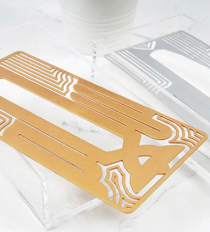 Metal and acrylic tissue box in Arabic calligraphy line art gold